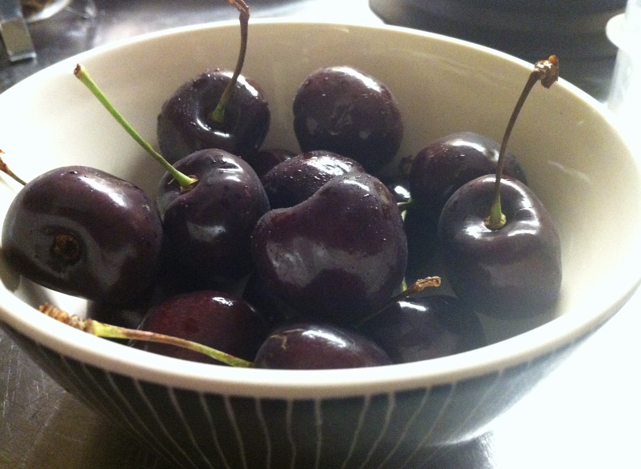 A bowl of dark ripe cherries